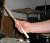 Hold the stick between forefinger and thumb